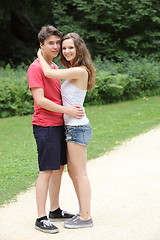 Image showing Happy couple of teenagers hugging each other