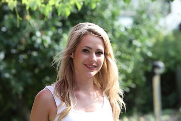 Image showing Attractive blond woman in the garden