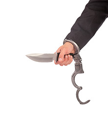 Image showing Male with a sharp knife in it's hand with a handcuff