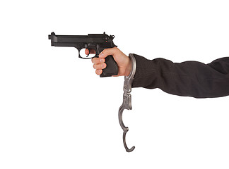 Image showing Businessman with gun and handcuffs