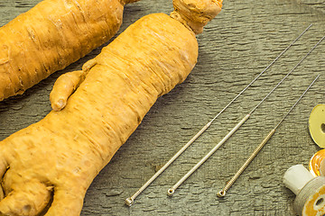 Image showing acupuncture needles and ginseng root