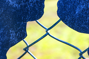 Image showing hole in a fence