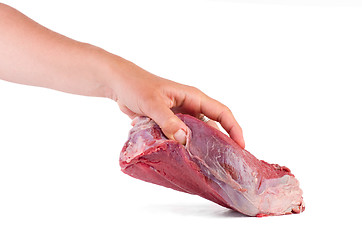 Image showing Hand take raw veal slab