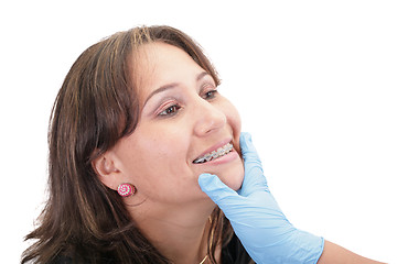 Image showing Woman checking his routine brackets on her dentist