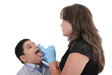 Image showing Child at the physician checking his throat