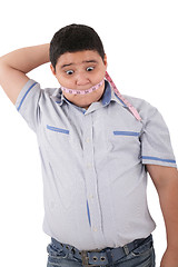 Image showing Fat boy with a measuring tape.  Its time to diet