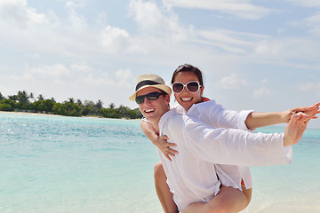 Image showing happy young couple have fun on beach