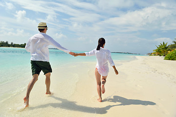 Image showing happy young couple have fun on beach