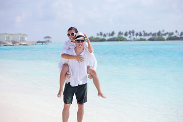 Image showing happy young couple have fun on beach