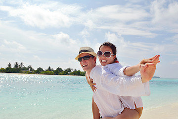 Image showing happy young couple have fun on beach