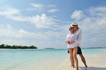 Image showing happy young couple have fun on beach