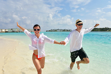 Image showing happy young couple have fun on beach