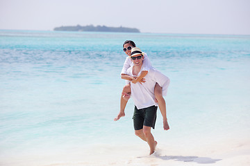 Image showing happy young couple have fun on beach