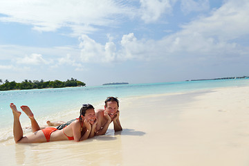 Image showing happy young couple have fun on beach