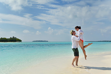 Image showing happy young couple have fun on beach