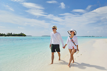 Image showing happy young couple have fun on beach