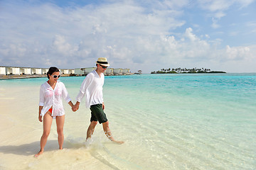 Image showing happy young couple have fun on beach