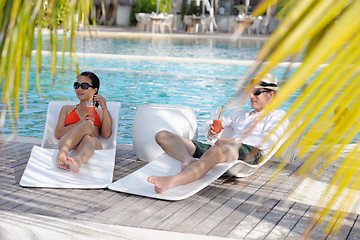 Image showing happy young couple relax and take fresh drink