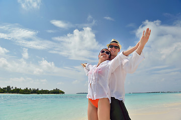 Image showing happy young couple have fun on beach