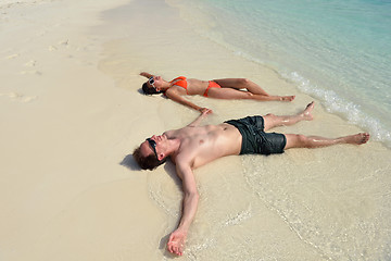 Image showing happy young couple have fun on beach