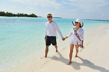 Image showing happy young couple have fun on beach