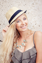 Image showing happy young blonde woman with hat outdoor summertime