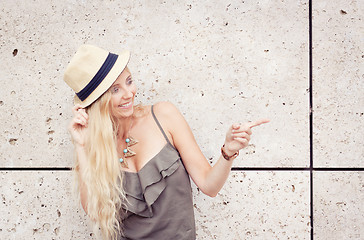 Image showing happy young blonde woman with hat outdoor summertime