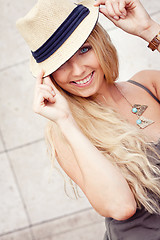 Image showing happy young blonde woman with hat outdoor summertime