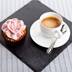 Image showing tasty sweet cupcake and hot aromatic espresso coffee