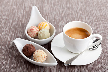 Image showing sweet delicious truffle pralines chocolate and hot espresso coffee