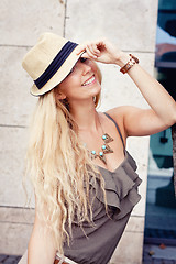 Image showing happy young blonde woman with hat outdoor summertime