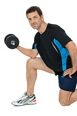 Image showing adult attractive man with iron dumbbell isolated