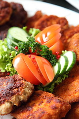 Image showing Crumbed fried meat and fish on a buffet