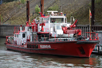 Image showing Fire tender moored at the quay in port