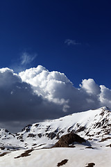 Image showing Snowy mountains and blue sky with clouds