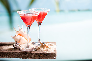 Image showing red drink on beach