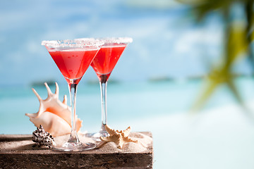 Image showing red drink on beach