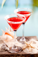 Image showing red drink on beach