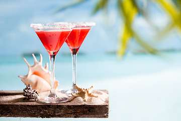 Image showing red drink on beach