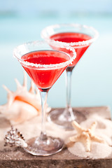 Image showing red drink on beach