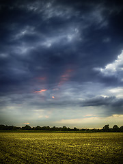 Image showing Dark clouds at sunset