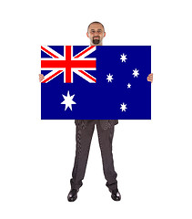 Image showing Smiling businessman holding a big card, flag of Australia