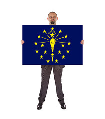 Image showing Smiling businessman holding a big card, flag of Indiana