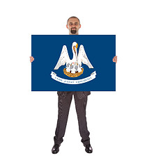 Image showing Smiling businessman holding a big card, flag of Louisiana