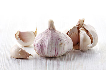 Image showing garlic on a white wooden table