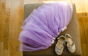 Image showing girl lilac ballerina skirt light gray shiny shoes  