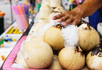 Image showing Young coconut drinks on street