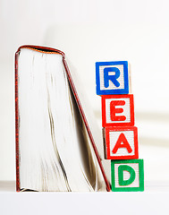 Image showing Read alphabet Block besides book