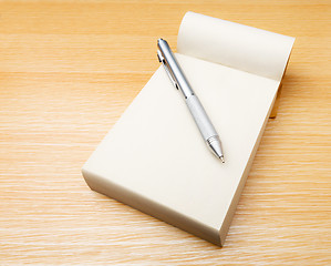 Image showing Memo pad and pen on the table