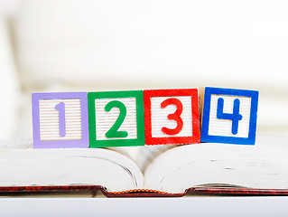 Image showing Alphabet block with 1234 on book